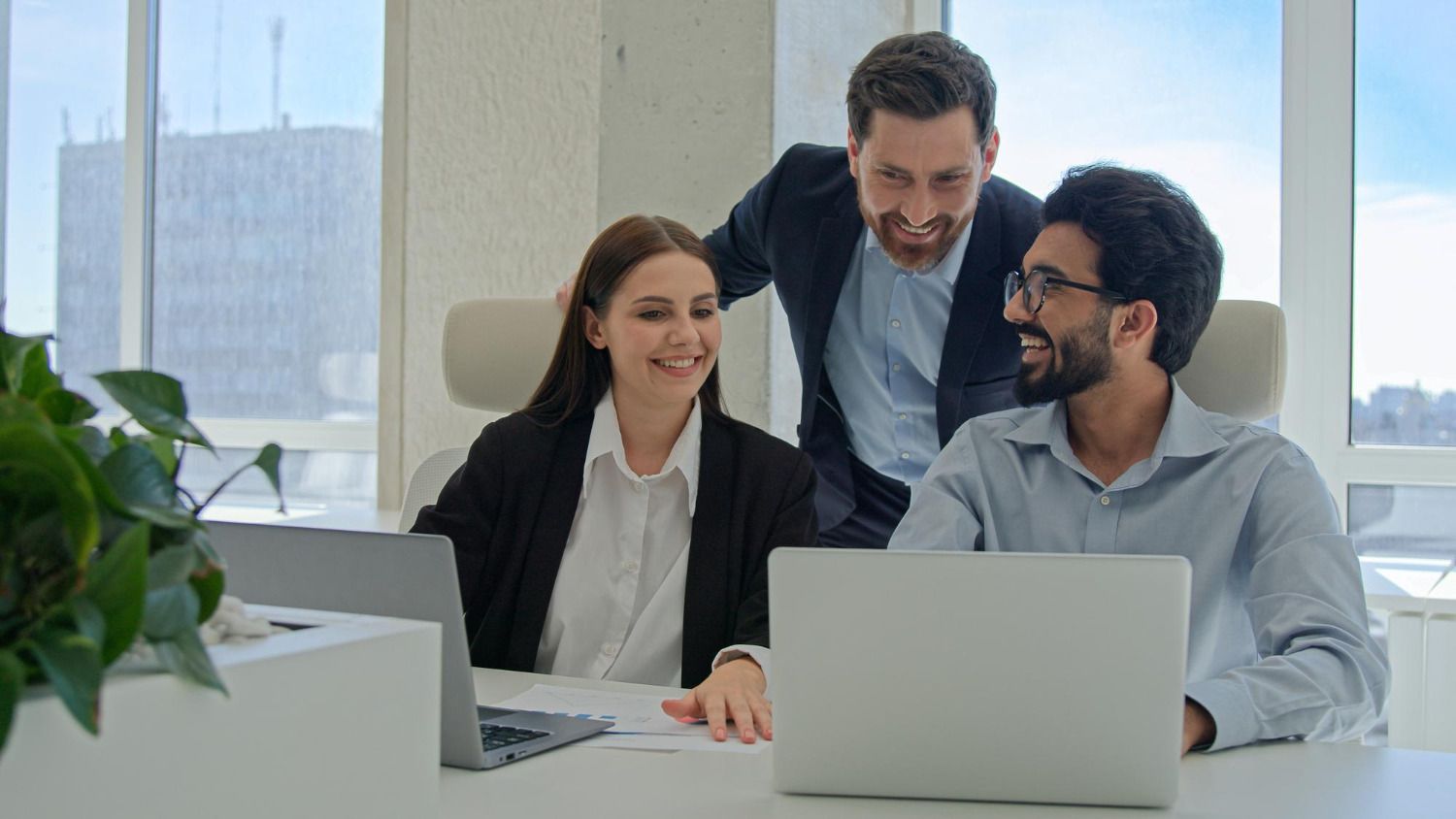 three employees working together